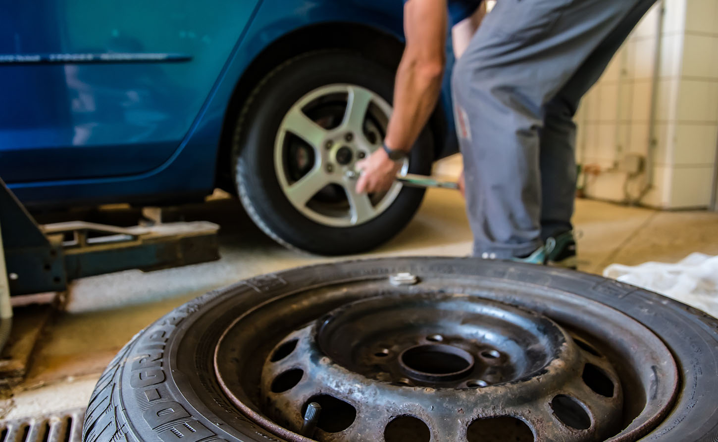 mechanic changing a tire