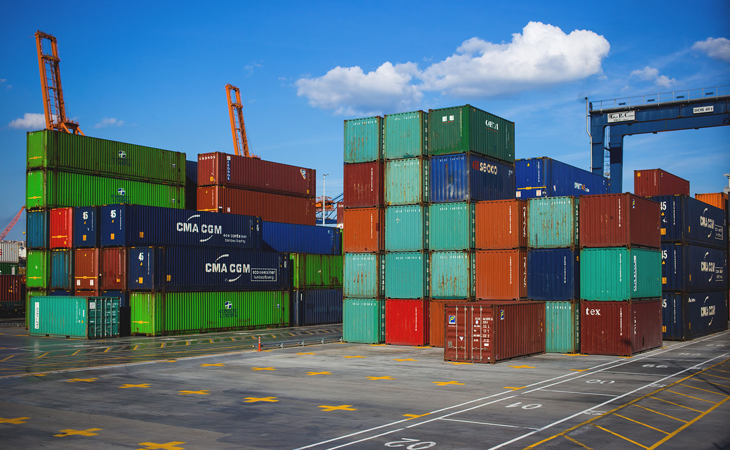 storage containers stacked in a loading/unloading area