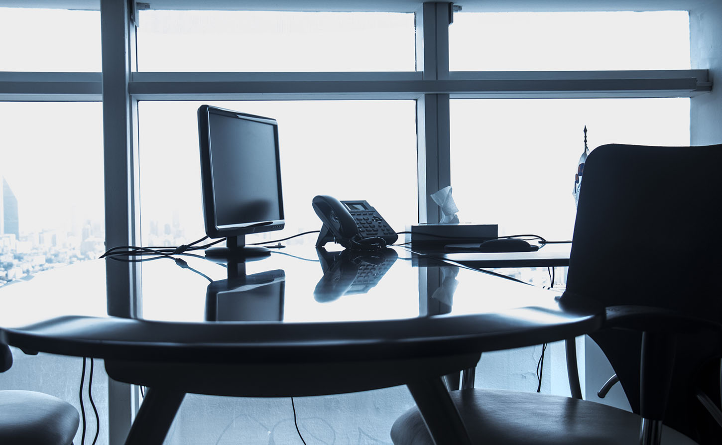 office desk with computer and phone