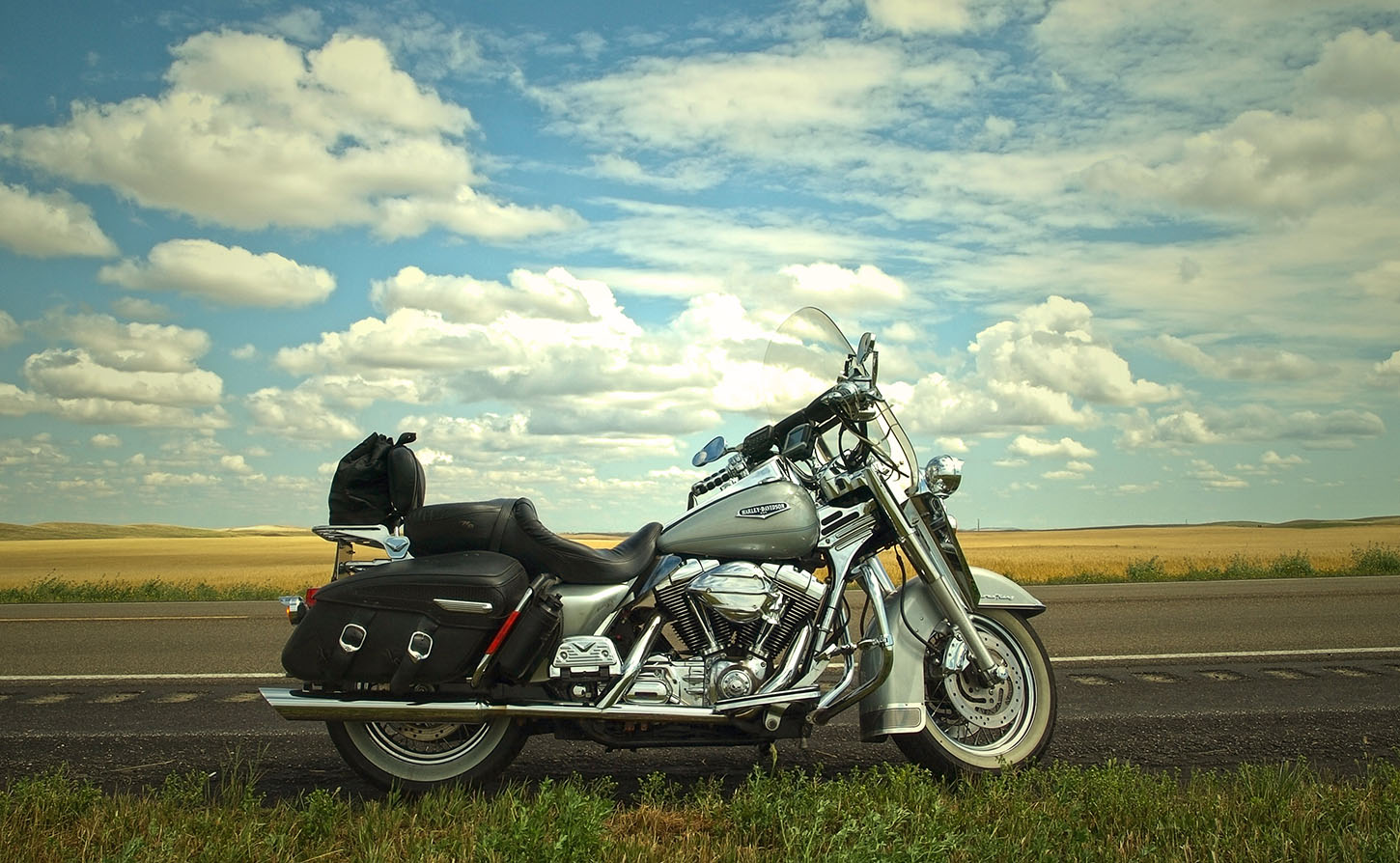 motorcycle parked on side of highway