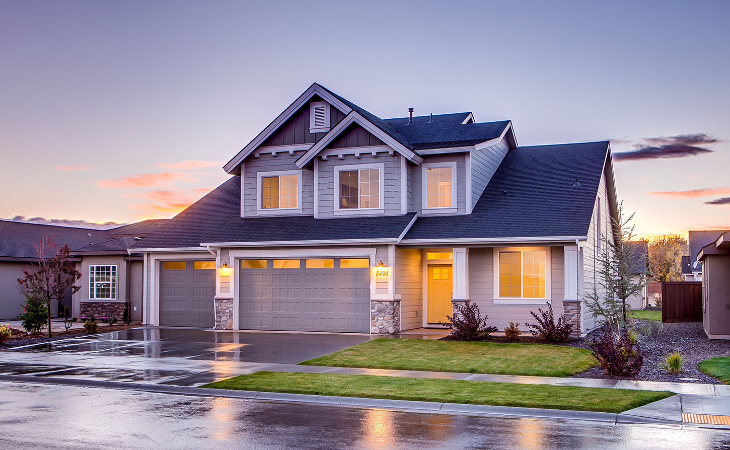 grey house with lights on