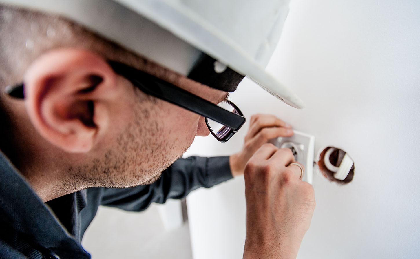 electrician working on an outlet