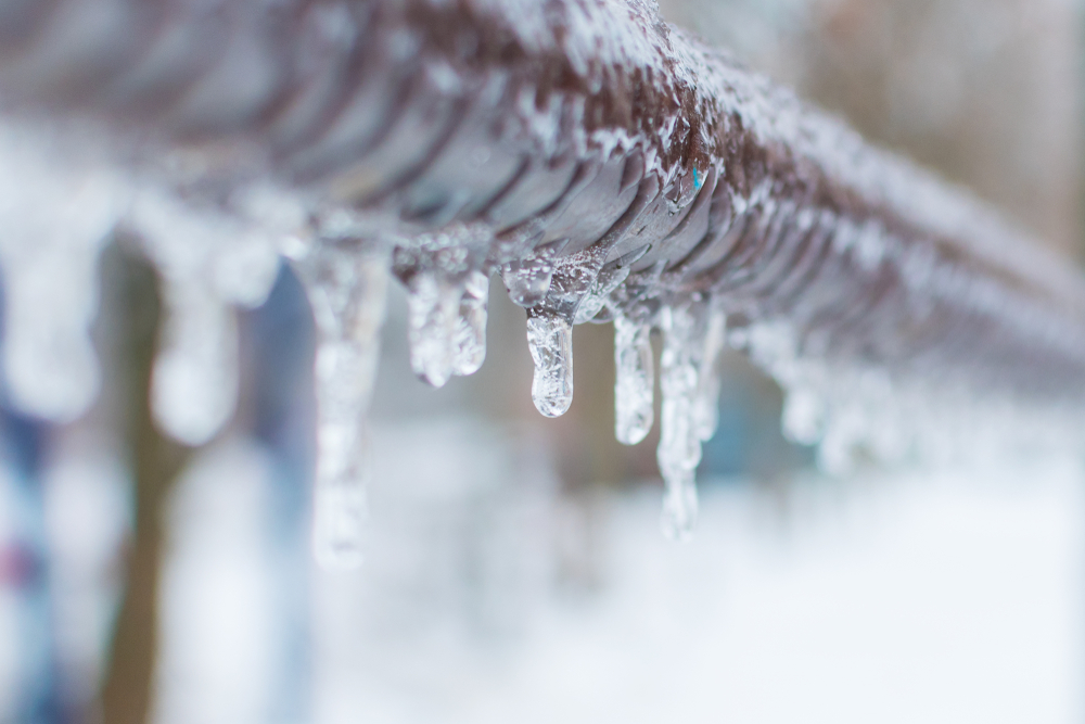 Frozen Icicles On a Pipe